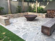 Autumn Porphyry fire pit surround by JHW